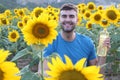 Handsome farmer holding sunflower oil bottle Royalty Free Stock Photo