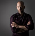 Handsome Fashion Man. Bearded Men Face Portrait in Shirt over dark Gray Background. Elegant Male Model Bald Head and Unsaved Royalty Free Stock Photo