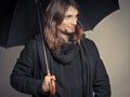 Handsome fashion man portrait wearing black coat. Royalty Free Stock Photo