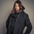 Handsome fashion man portrait wearing black coat. Royalty Free Stock Photo