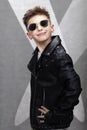 Handsome fashionable little boy in a leather jacket Royalty Free Stock Photo