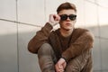 Handsome fashionable young man in sunglasses Royalty Free Stock Photo