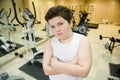 Handsome fat thick caucasian boy in white shirt in sport gym wei