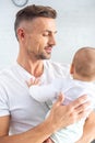 handsome father holding baby Royalty Free Stock Photo