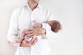 Handsome father holding his sleeping newborn baby daughter Royalty Free Stock Photo