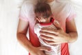 Handsome father holding his sleeping newborn baby daughter Royalty Free Stock Photo