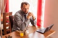 Handsome fit man sitting in restaurant.