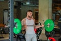 Handsome fit muscular caucasian man workout in the gym with weight pumping up muscles. Fitness and bodybuilding sport Royalty Free Stock Photo