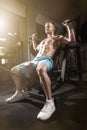 Handsome fitness man weightlifting workout in gym Royalty Free Stock Photo