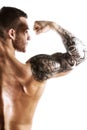 Handsome fitness model showing biceps muscles Royalty Free Stock Photo