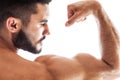 Handsome fitness model showing biceps muscles Royalty Free Stock Photo