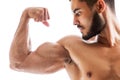 Handsome fitness model showing biceps muscles Royalty Free Stock Photo