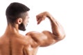 Handsome fitness model showing biceps muscles Royalty Free Stock Photo