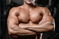 Handsome fitness model train in the gym gain muscle