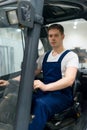 Handsome forklift operator. Royalty Free Stock Photo