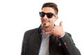 Handsome and funky sales man making call me gesture Royalty Free Stock Photo