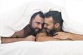 A Handsome gay men couple on bed together Royalty Free Stock Photo