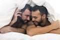 A Handsome gay men couple on bed together Royalty Free Stock Photo