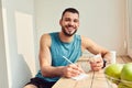 Cheerful young man holding pills and making notes Royalty Free Stock Photo