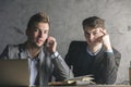 Handsome gentlemen on phone doing paperwork Royalty Free Stock Photo