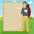 Handsome golfer showing something on blank board standing on golf course