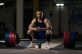 Attractive Young Man Resting In Gym Afther Exercise Royalty Free Stock Photo