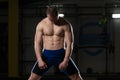 Attractive Young Man Resting In Gym Afther Exercise Royalty Free Stock Photo