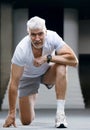 Gray haired senior injured knee or leg. Sport and health care concept