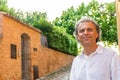 Handsome green eyes relaxed man near medieval walls Royalty Free Stock Photo