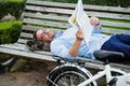 Handsome grizzled man reading newspaper. Royalty Free Stock Photo