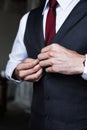 Handsome Groom Dressing Up for Wedding Ceremony