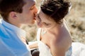 Handsome groom kisses his beautiful bride close up. Top view Royalty Free Stock Photo