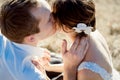 Handsome groom kisses his beautiful bride close up. Top view Royalty Free Stock Photo