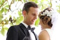 Handsome groom looking lovingly into bride eyes