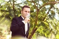 Handsome groom wedding day Smiling and drinking wine or champagne Royalty Free Stock Photo