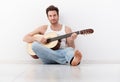 Handsome guitar player practicing Royalty Free Stock Photo