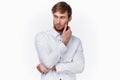 handsome guy blond in a light shirt on a white background cropped view Royalty Free Stock Photo