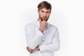 handsome guy blond in a light shirt on a white background cropped view Royalty Free Stock Photo