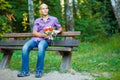 Handsome guy with bouquet waiting for his girlfrie