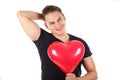 Handsome guy holding a heart-shaped balloon Royalty Free Stock Photo