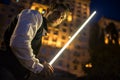 Handsome guy holding a lightsaber Jedi Royalty Free Stock Photo