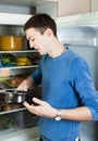 Handsome guy looking in pan Royalty Free Stock Photo