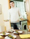 Handsome guy serving festive table Royalty Free Stock Photo