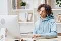 handsome guy sitting in front of the computer work at home technologies Royalty Free Stock Photo