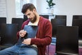 Handsome guy sitting and sleaping hugging clipboard Royalty Free Stock Photo