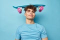 handsome guy skateboard in hand in blue t-shirts Lifestyle unaltered Royalty Free Stock Photo