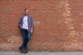 Handsome guy standing near brick wall Royalty Free Stock Photo