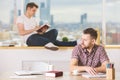 Handsome guys reading book and doing paperwork Royalty Free Stock Photo