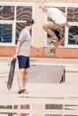 Handsome guys riding and doing trick by skateboard