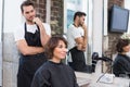 Handsome hair stylist with client Royalty Free Stock Photo